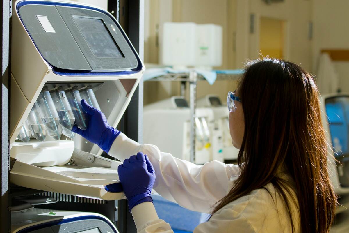A lab technician performs third-party HPLC testing on catalog peptides.
